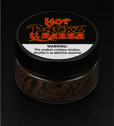 Close-up of a Hot Packz Grabba jar with nicotine warning label